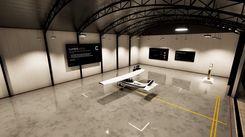 Inside a bright aircraft hangar with a polished floor: a small white plane, and the company's pages on wall screens.